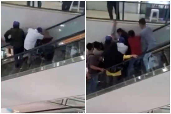 Ticarət mərkəzində gəncin başı eskalatorda sıxışdı - VİDEO