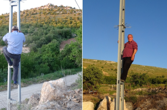 Rabitə problemi təhlükəli vəziyyət yaratdı: Telefonla danışmaq üçün dirəklərə çıxırlar - VİDEO
