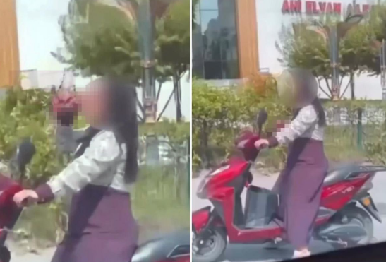 Motosikletdə hərəkət zamanı spirtli içki qəbul edən qadının görüntüləri etiraz doğurdu - VİDEO