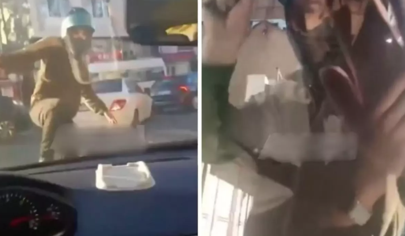 Motosikletçi küçədə dava etdiyi sürücüyə hücum etdi - VİDEO