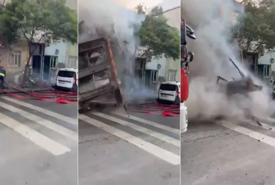 Yanan bina yanğınsöndürənlərin üzərinə çökdü - VİDEO