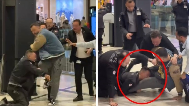 Ticarət mərkəzində dava: Mühafizəçi müştərinin ayağını dişlədi - VİDEO