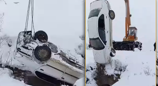 Qarlı havada maşın su kanalına düşüb - VİDEO